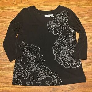 Chico's Travelers black tunic with white floral white graphics.